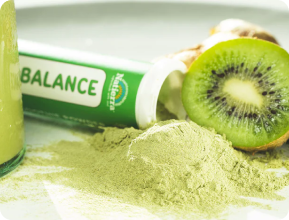 Green Balance Organic Smoothie Powder tube with a kiwi