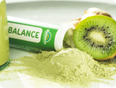 Green Balance Organic Smoothie Powder tube with a kiwi