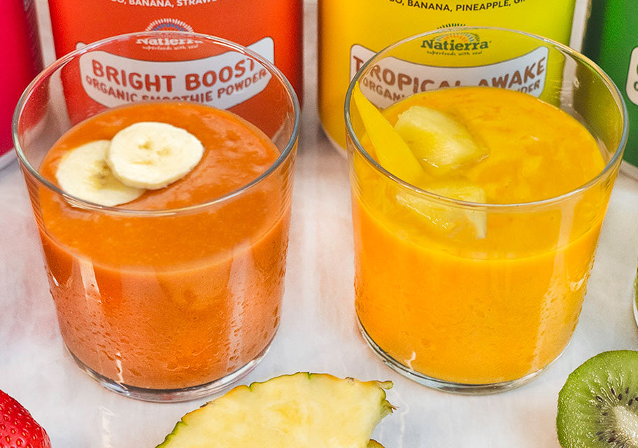 Bright Boost Smoothie and Tropical Awake smoothie in glass jar with smoothie jar in background