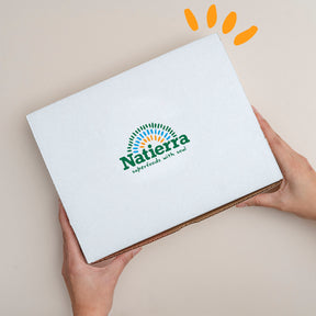Natierra smoothie box held by 2 hands with colored beads on the top thumbnail