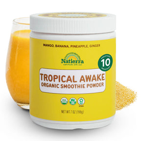 Natierra Tropical Awake Organic Smoothie jar with glass and powder in the background