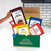 Natierra Organic Freeze Dried Fruit bags and organic cacao nibs bag on a subscription box