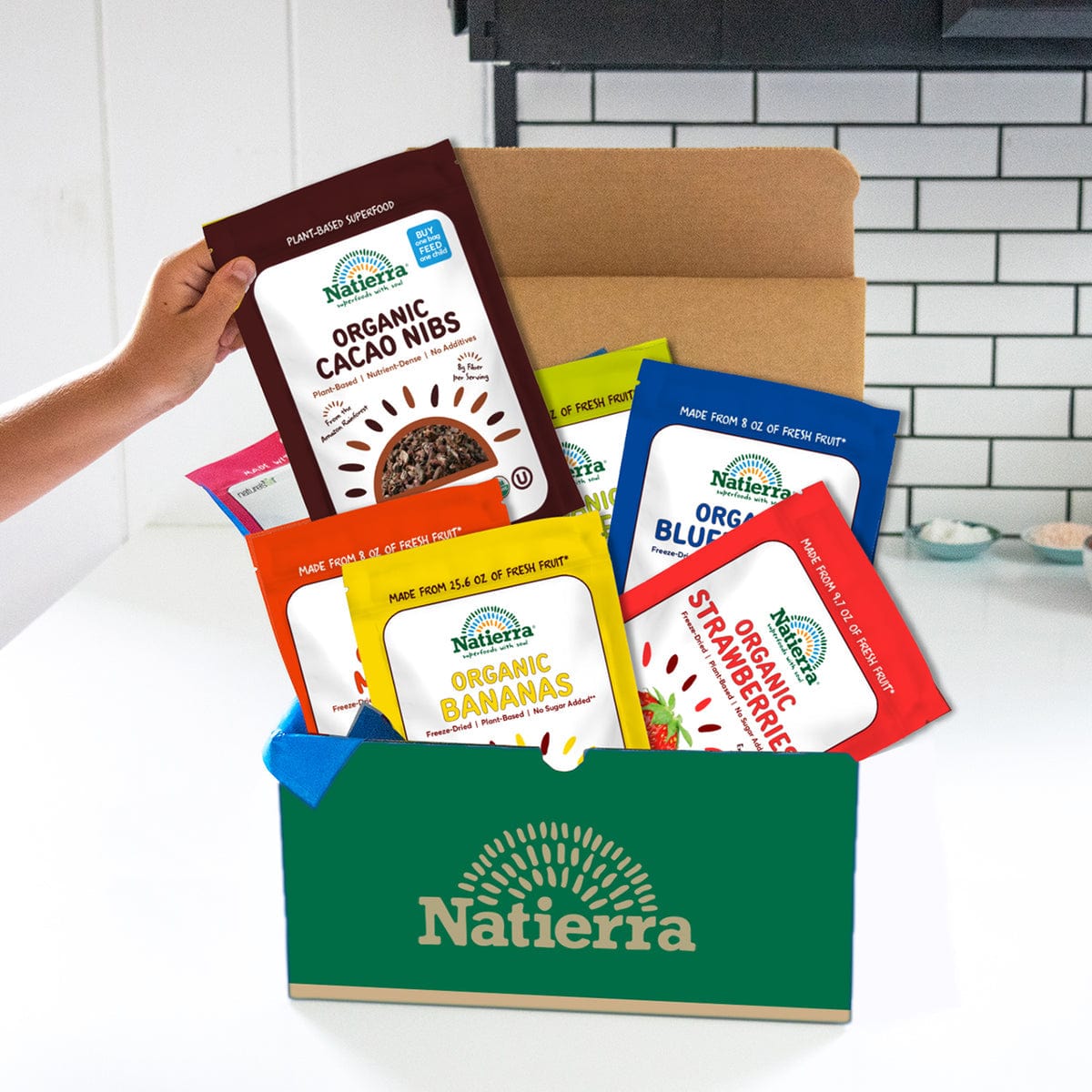 Natierra Organic Freeze Dried Fruit bags and organic cacao nibs bag on a subscription box